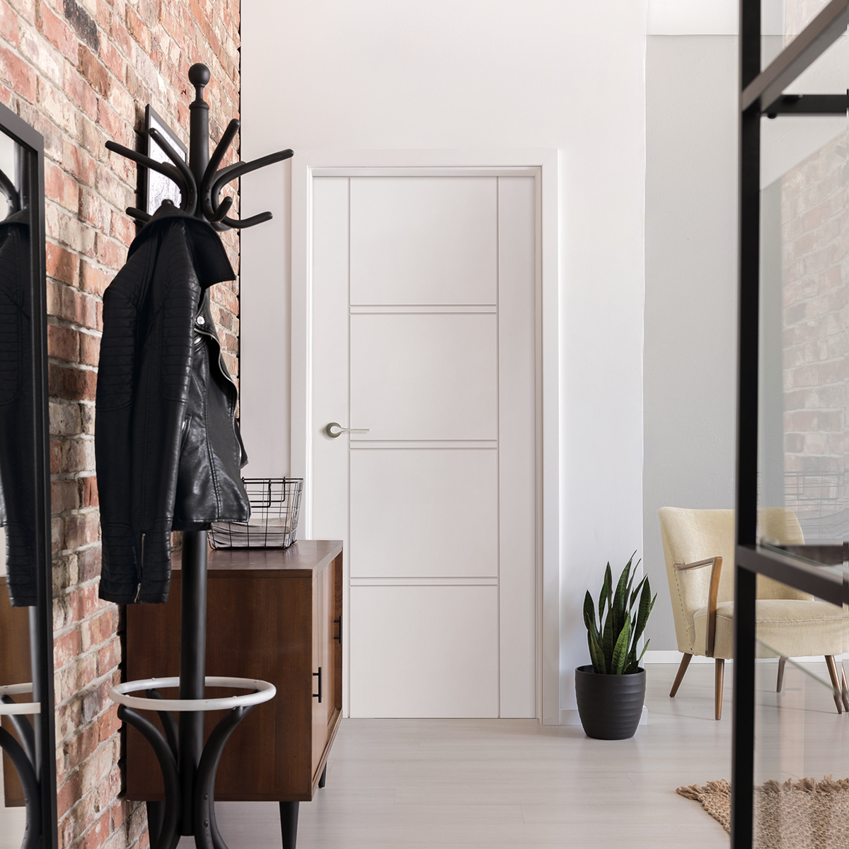 Vertical view of elegant entrance hall with white door and woode